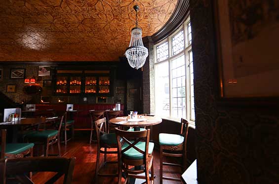 A table by the window at the Oval Bar Dublin