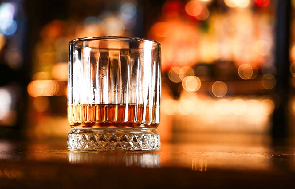 Whiskey served neat upon a countertop